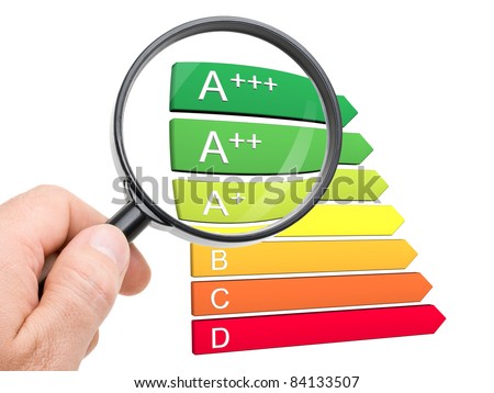 Hand with magnifying glass looking at the new A+, A++ and A+++ classes of the european energy efficiency classification Royalty-Free Stock Photo #84133507