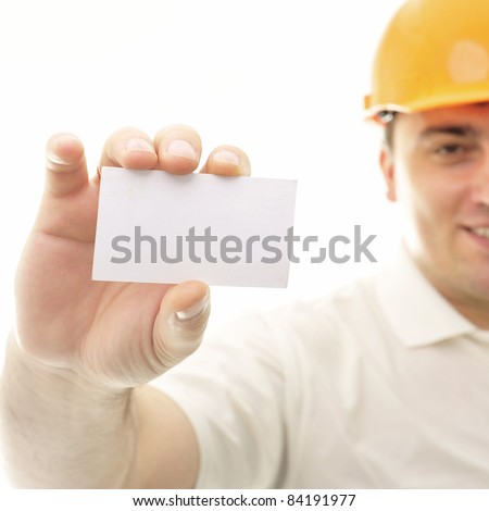 Closeup portrait of adult engineer man holding blank business card