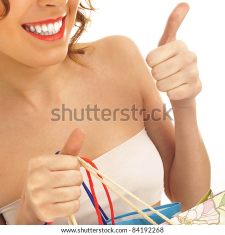 Portrait of lovely woman with shopping bags over white