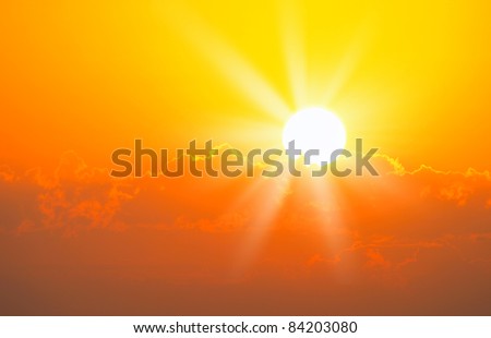Brilliant orange sunrise over clouds in Iowa with bright yellow sun on a cool spring morning. Royalty-Free Stock Photo #84203080