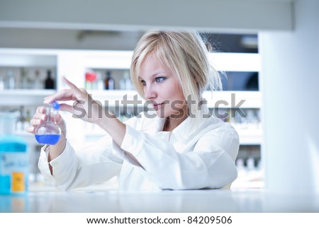 portrait of a female researcher doing research in a lab (color toned image)