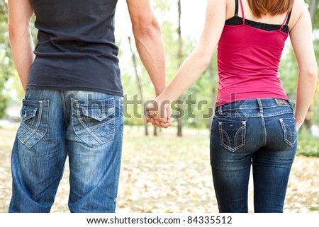 romantic couple holding hands, outdoor