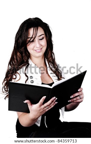 beautiful girl reading a book on a cutout white background