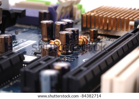 close up photo of part of a motherboard circuit board close up ,