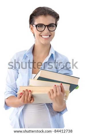 Attractive university student holding books in hand.?