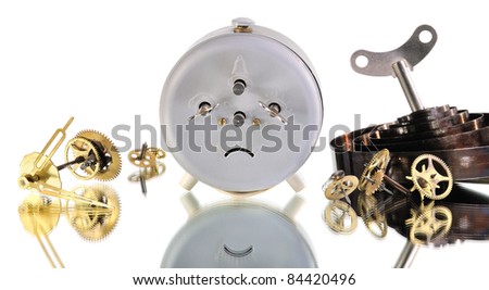 Alarm clock and Old Clockwork on a white background