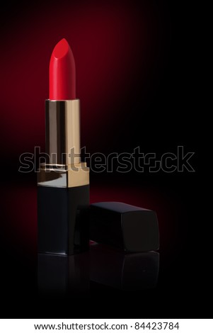 Red lipstick isolated on Black background