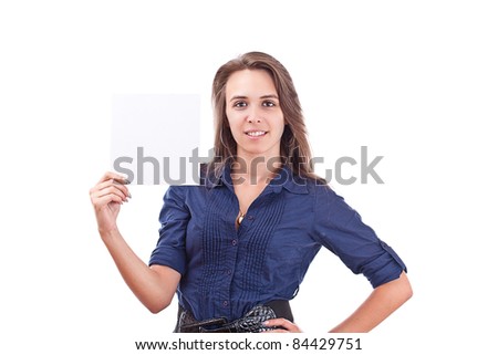 Portrait of a serious young woman pointing at blank card in her hand against white background