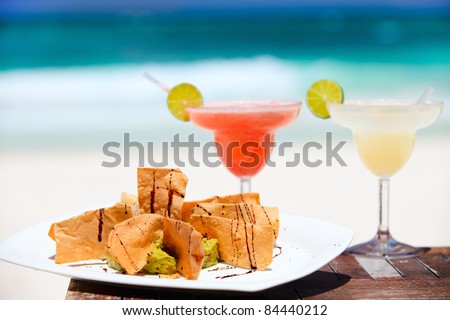 Traditional mexican tortilla chips and margarita cocktails