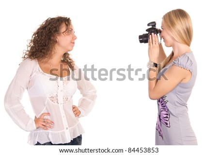 portrait of a two girls taking pictures on a white