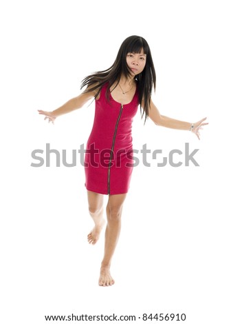 Asian woman in action on one leg over white background