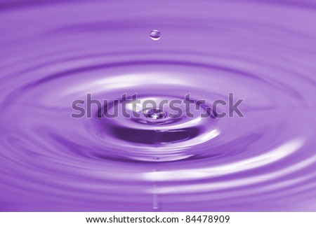 Colorful  purple water drop and splash