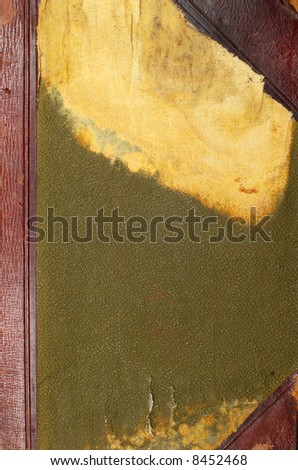 Old green book cover isolated on white close up