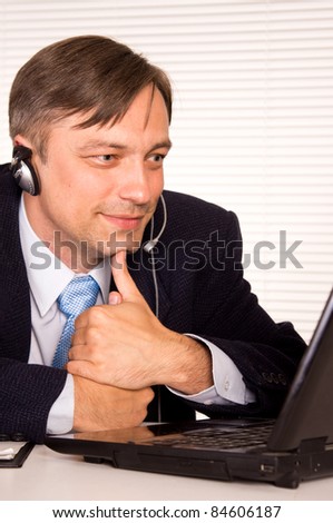 portrait of a nice man with computer