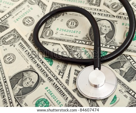 Stethoscope and dollars illustrating expensive healthcare
