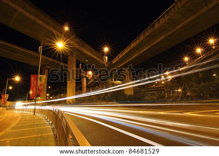 Light rail on the overpass at night