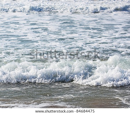 beach waves near coastline, extreme closeup photo
