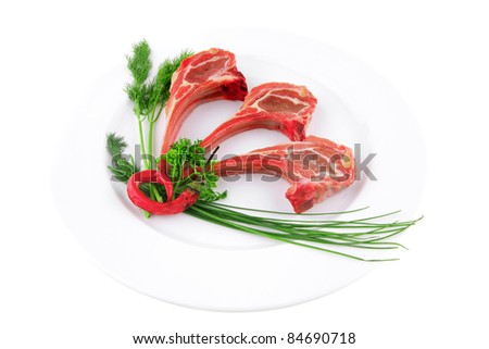 fresh raw lamb ribs served on plate