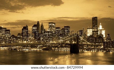 Brooklyn bridge and NYC skyline at sunset in sepia tone