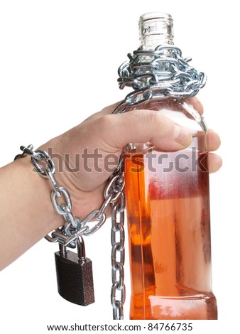 Color photo of wineglass of whiskey and metal chain