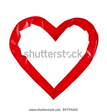 red heart  of adhesive sticky   tape isolated on white