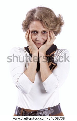 sad senior woman with her hans on her face (isolated on white)