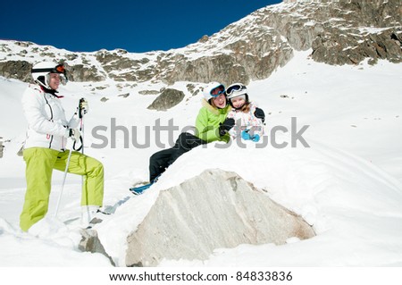 Winter, ski vacation - happy skiers portrait