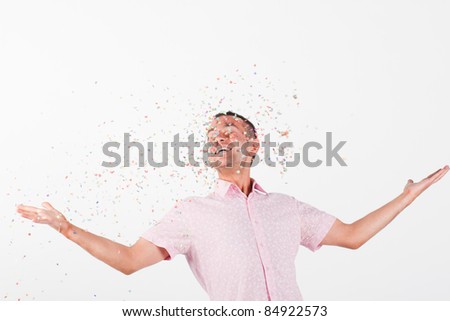 happy man with flying confetti celebration decoration
