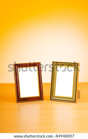 Wooden picture frames on the gradient background