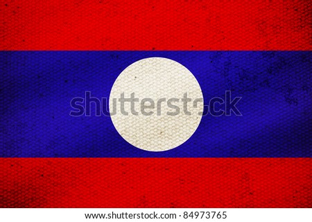 flag of Laos, white circle on blue tab with red tab frame.