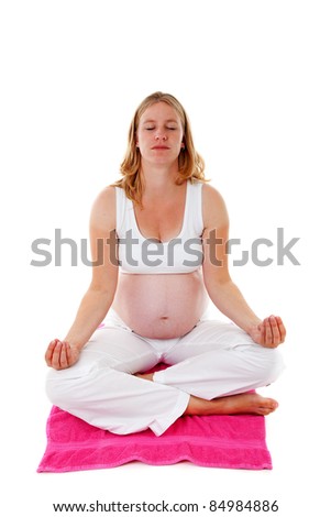 woman doing meditative pregnancy yoga over white background