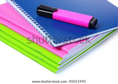 bright notebooks and marker isolated on white