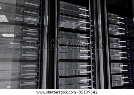 Dark Servers Room. Glassy-Metallic Server Racks. Wall of Servers. Dark Server Room 3D Generated Illustration. Hosting Related Theme. Royalty-Free Stock Photo #85109542