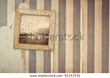 Aged room wall with hanging old picture. Image designed.