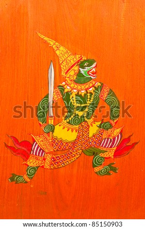 The Thai traditional drawing on wood public wall in temple, Thailand.