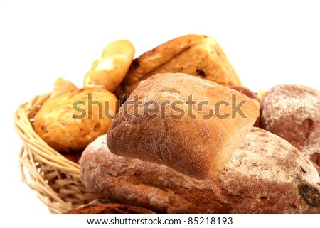 Fresh baked bread and wheat in a studio setting