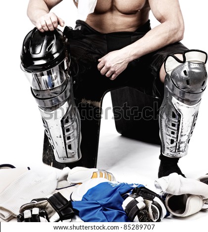 Picture of hockey player after game sitting in locker room