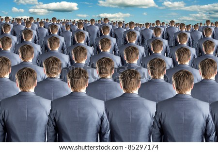 Rear view of many identical businessmen clones Royalty-Free Stock Photo #85297174