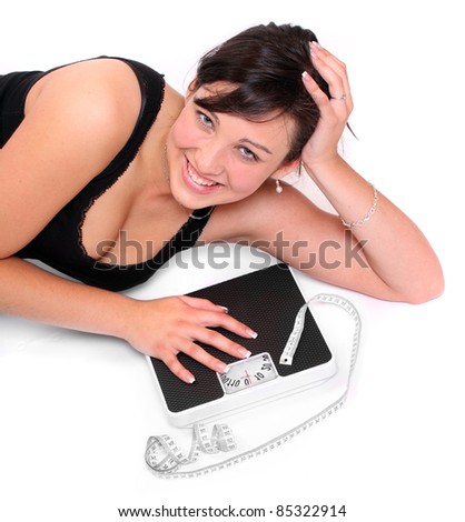 Picture of happy woman with bathroom scale.