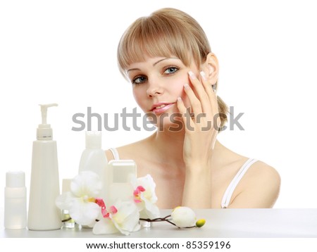 Portrait of pretty woman touching her face isolated