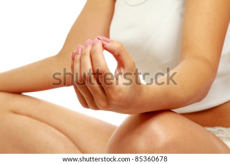 A lotus position in practise of yoga - on white background