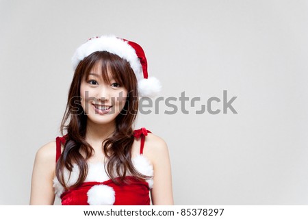 a portrait of attractive asian santa woman