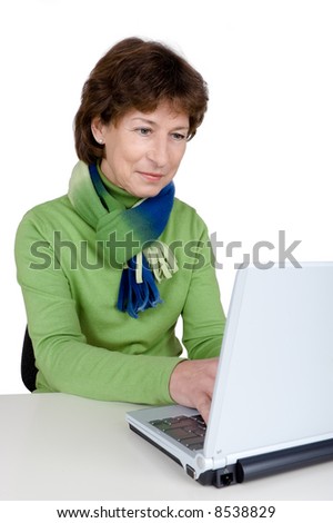 Senior woman is working with a notebook. Full isolated studio picture