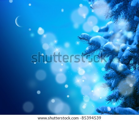 snow-covered Christmas tree on a blue night sky background