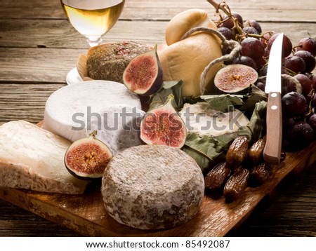 cheeseboard  with an assortment of cheeses and fruits