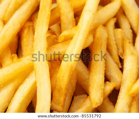 fried potato chips pile, extreme closeup photo