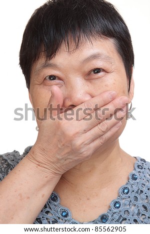 old woman covering her mouth