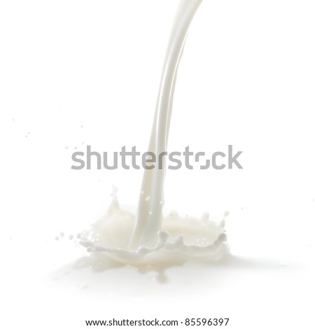 pouring milk splash isolated on white background Royalty-Free Stock Photo #85596397