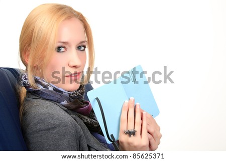 Woman with notebook. close up, studio shot