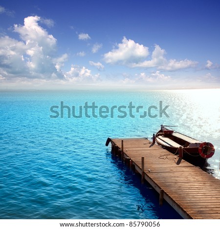 Albufera blue boats lake in El Saler Valencia Spain [Photo Illustration] Royalty-Free Stock Photo #85790056